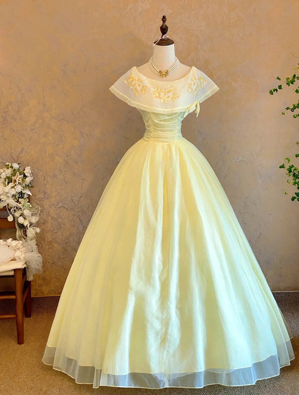 Light yellow crew-neck floor-length ball gown with a cinched waist and slim fit; bridal gown R7310