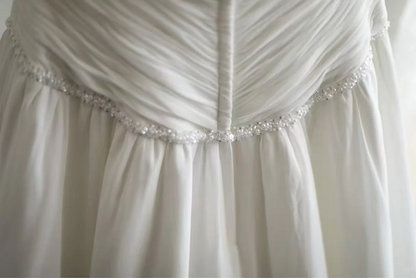 White strapless, fitted, long ball gown with pleats R6698