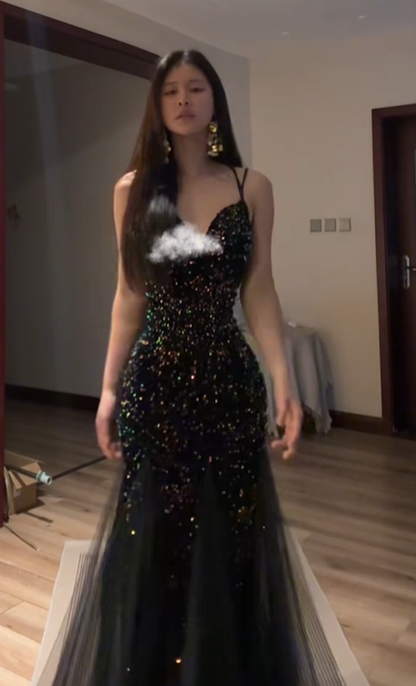 Sexy ball gown with black halter neck, fitted waist, and sequined fishtail skirt. R8065