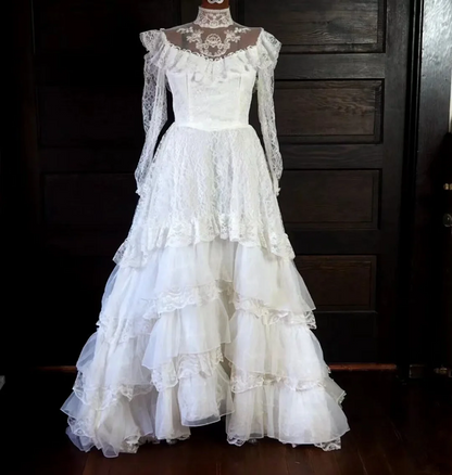 White lace square-neck long-sleeve ball gown with a cinched waist, vintage style and tiered cake skirt; bridal gown R7295