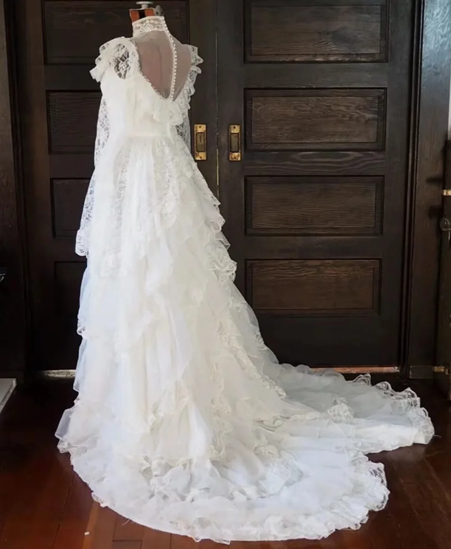 White lace square-neck long-sleeve ball gown with a cinched waist, vintage style and tiered cake skirt; bridal gown R7295