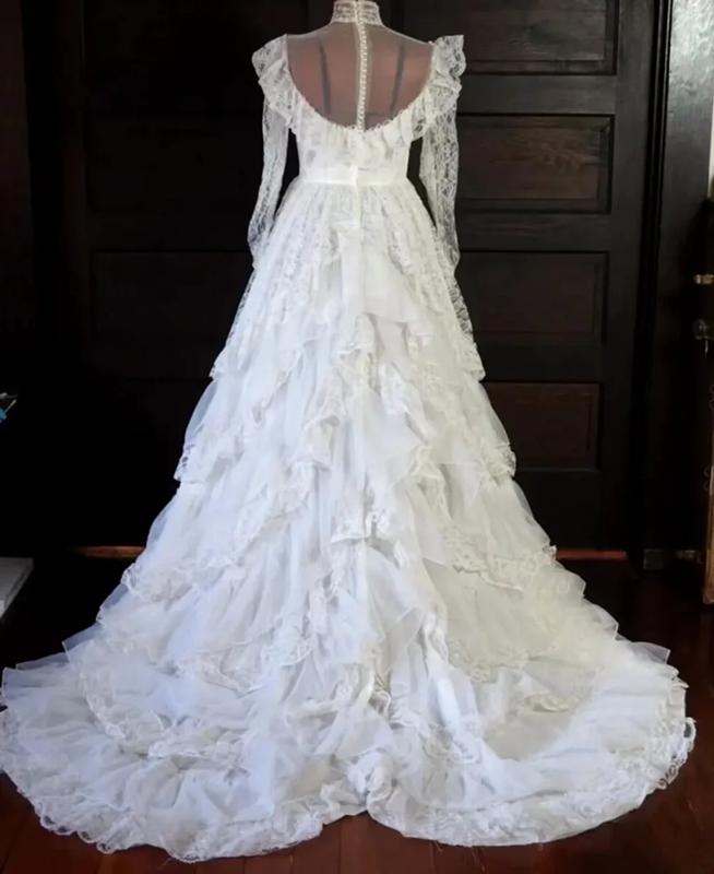 White lace square-neck long-sleeve ball gown with a cinched waist, vintage style and tiered cake skirt; bridal gown R7295