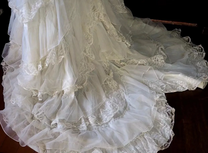 White lace square-neck long-sleeve ball gown with a cinched waist, vintage style and tiered cake skirt; bridal gown R7295