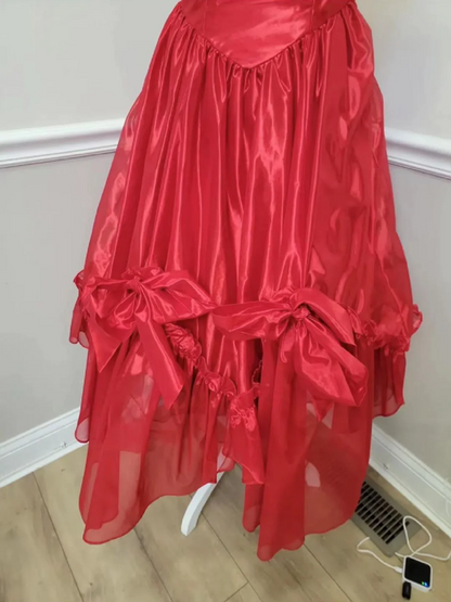 Red strapless ball gown with a cinched waist and an asymmetrical skirt; bridal gown R7297