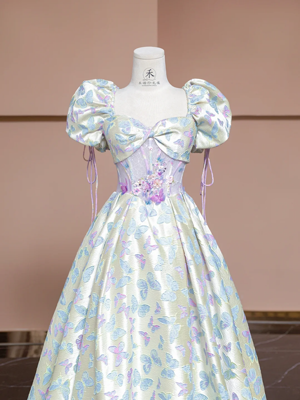 Off-white base with light purple butterfly print, fitted waist, long ball gown with a full skirt R8337