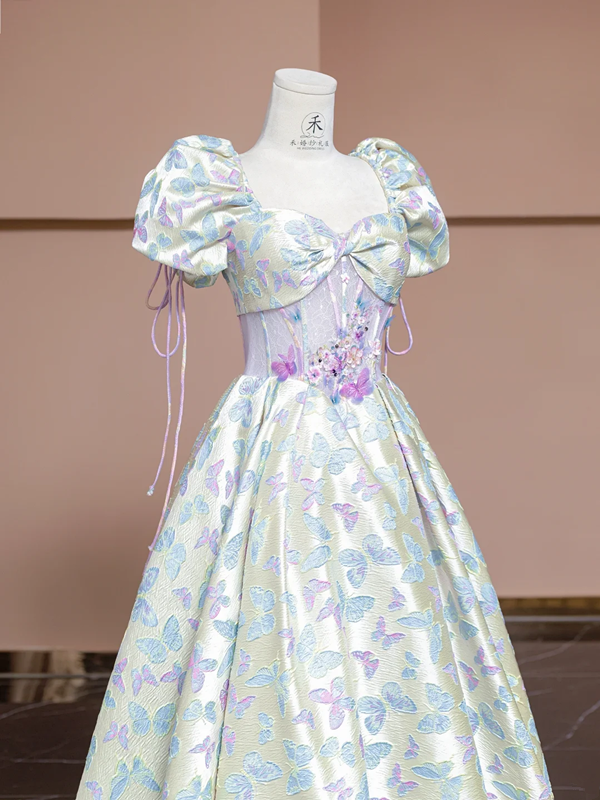 Off-white base with light purple butterfly print, fitted waist, long ball gown with a full skirt R8337