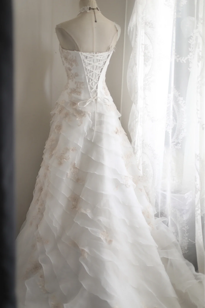 White strapless embroidered A-line ball gown with a fitted waist and full skirt R6771