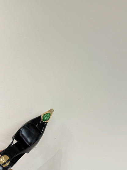 GREEN GEM-STUDDED SLINGBACK PUMPS IN BLACK PATENT CALFSKIN
